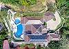 Birdseye view of Villa Sozo, including parking area in the front, and pool area in the back