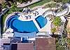 Birdseye view of pool, jacuzzi, fire pit and pool slide