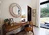 1 Queen-sized bedroom that includes a terrace that opens to the patio and green areas.