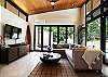 This modern one-story home includes high ceilings, and large glass sliding doors that open up for an ideal indoor/outdoor living space.