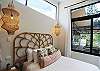 Second Queen-sized bedroom with a private bathroom and a window facing the green areas