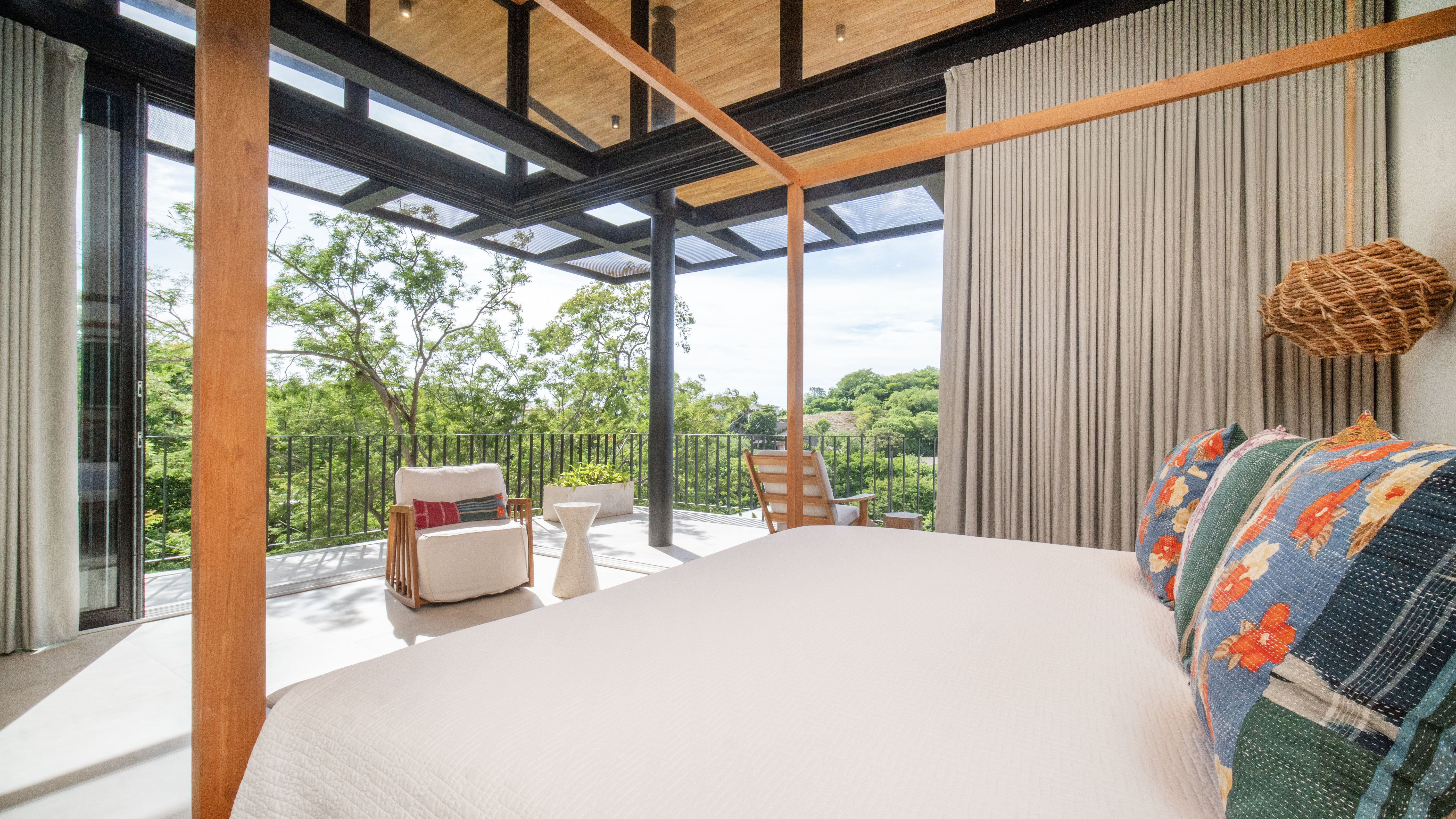 Bedroom with sliding doors opening to a private balcony