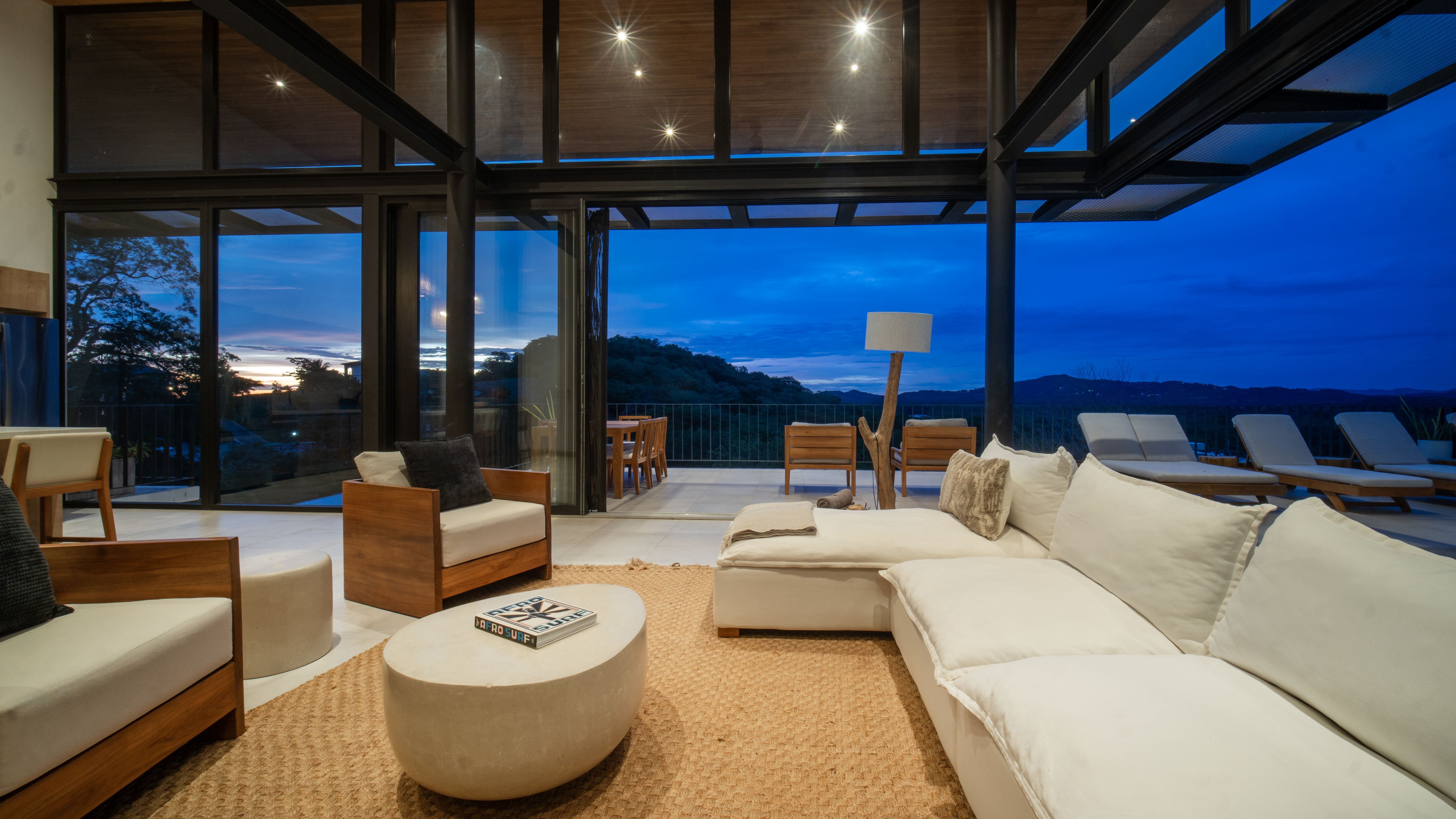 Living room with night views and warm lighting