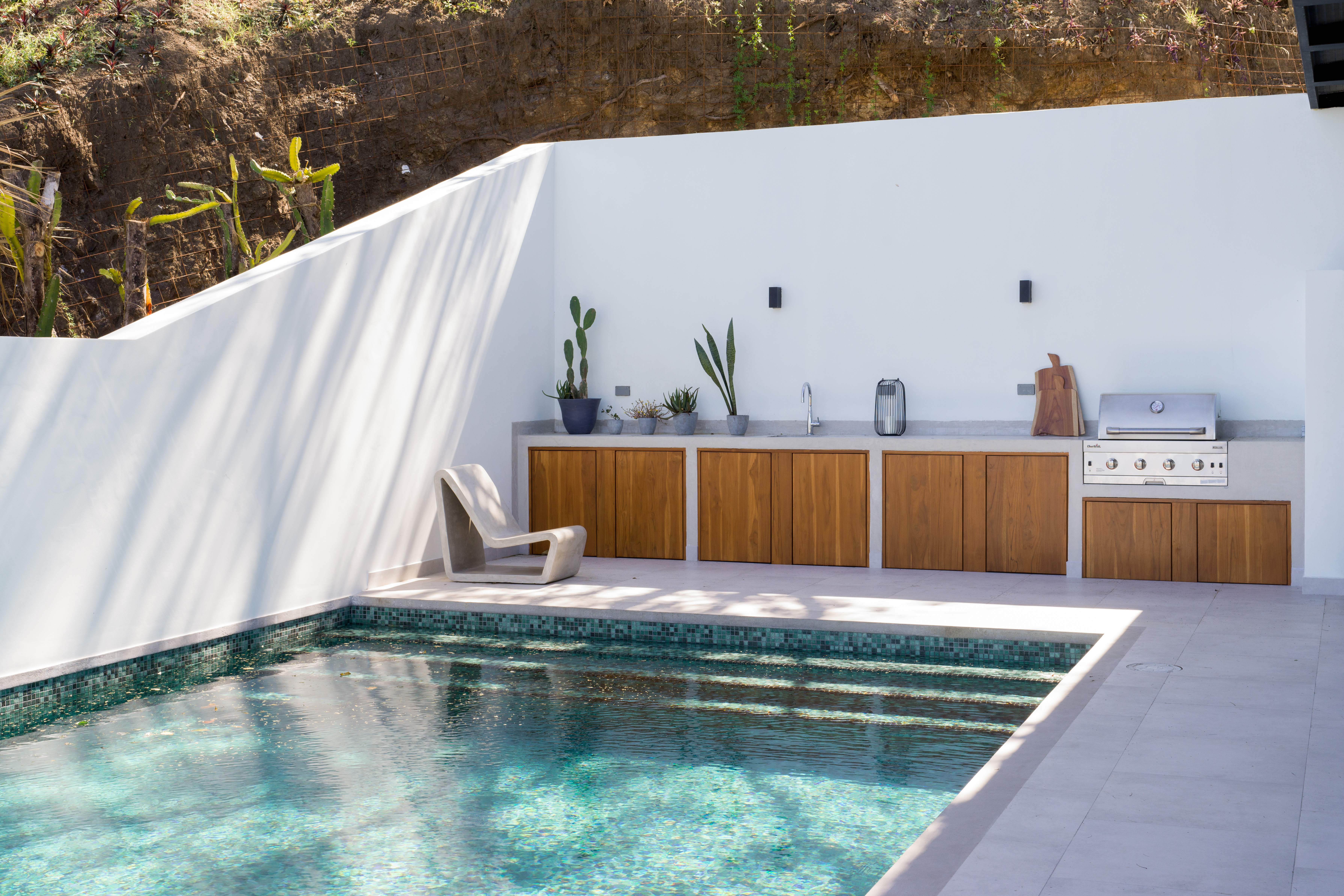 Relaxing pool area with BBQ