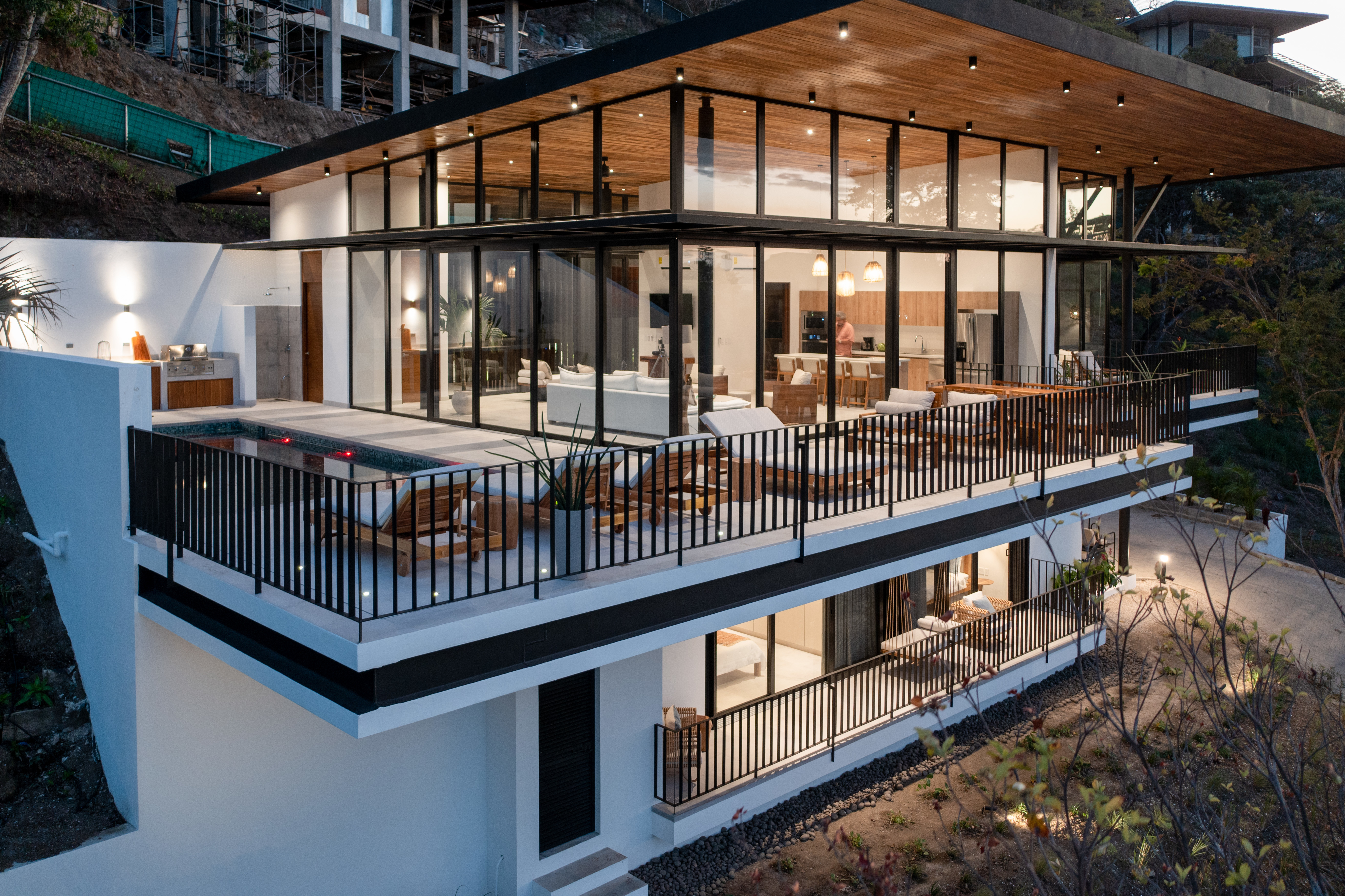 Elegant architectural home with full glass facade