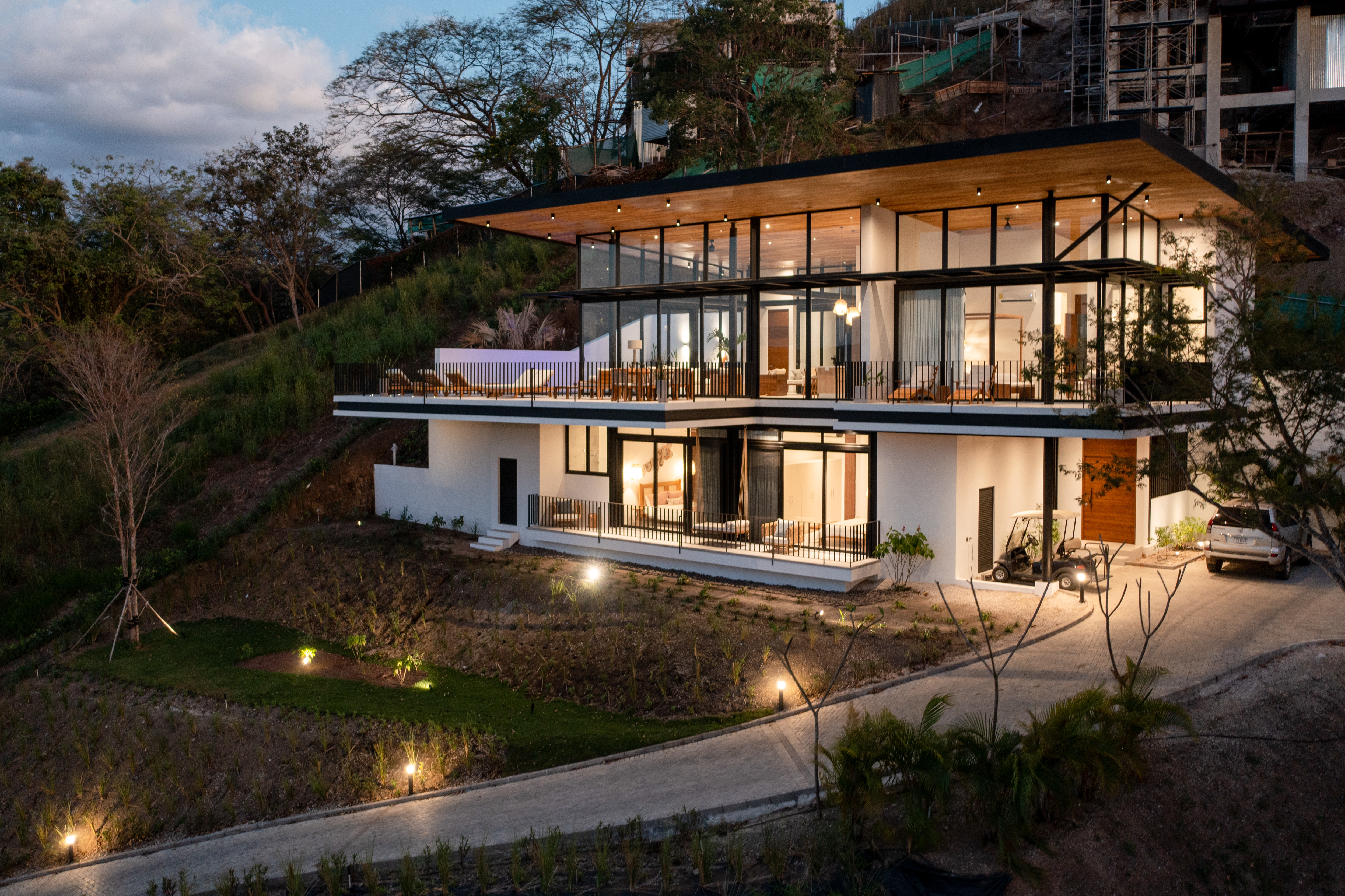 Multi-level luxury home nestled in hillside greenery