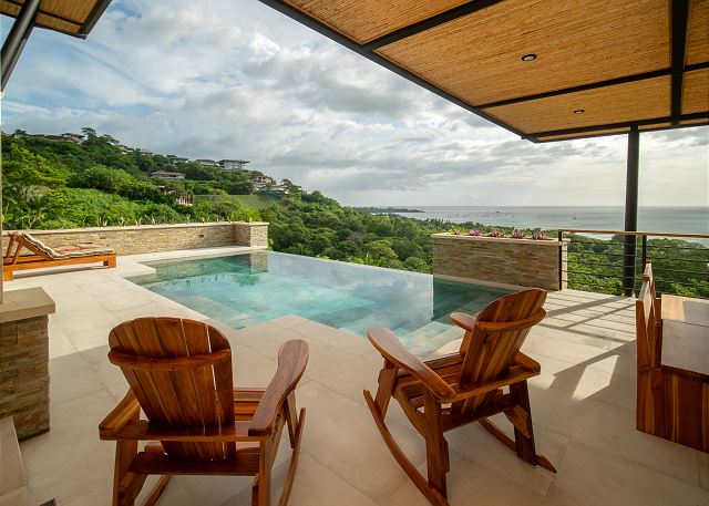 Nestled atop the verdant hills of Tamarindo, behold a sanctuary offering panoramic ocean vistas and invigorating sea breezes.