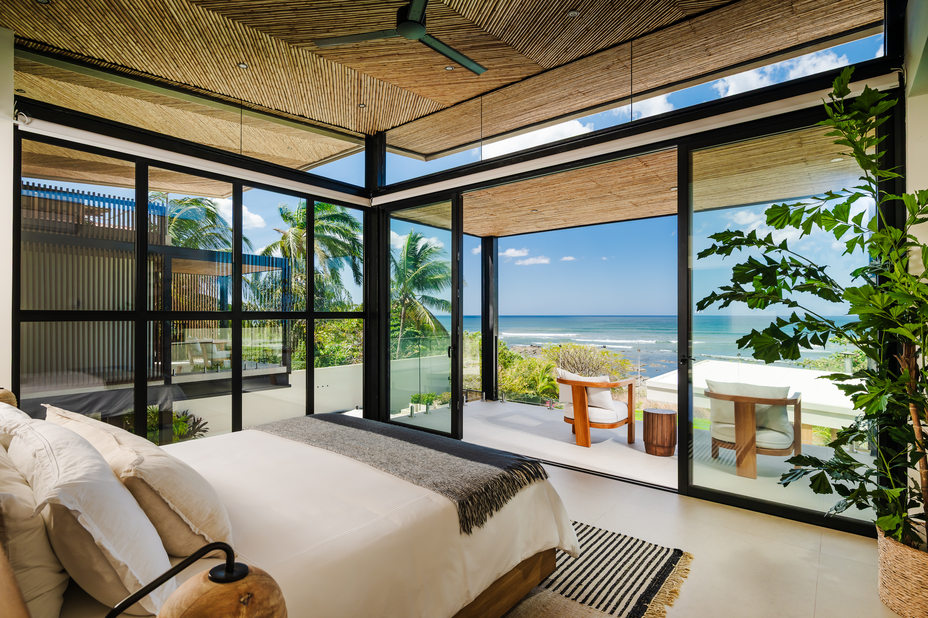 Elegant upstairs master suite features a luxurious king-size bed
