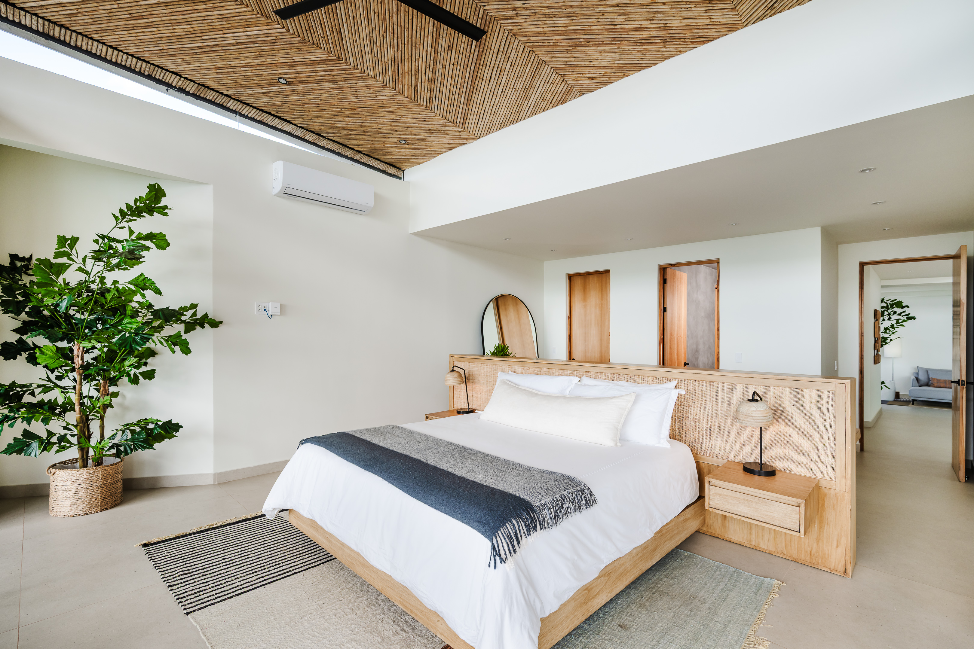 Elegant upstairs master suite features a luxurious king-size bed