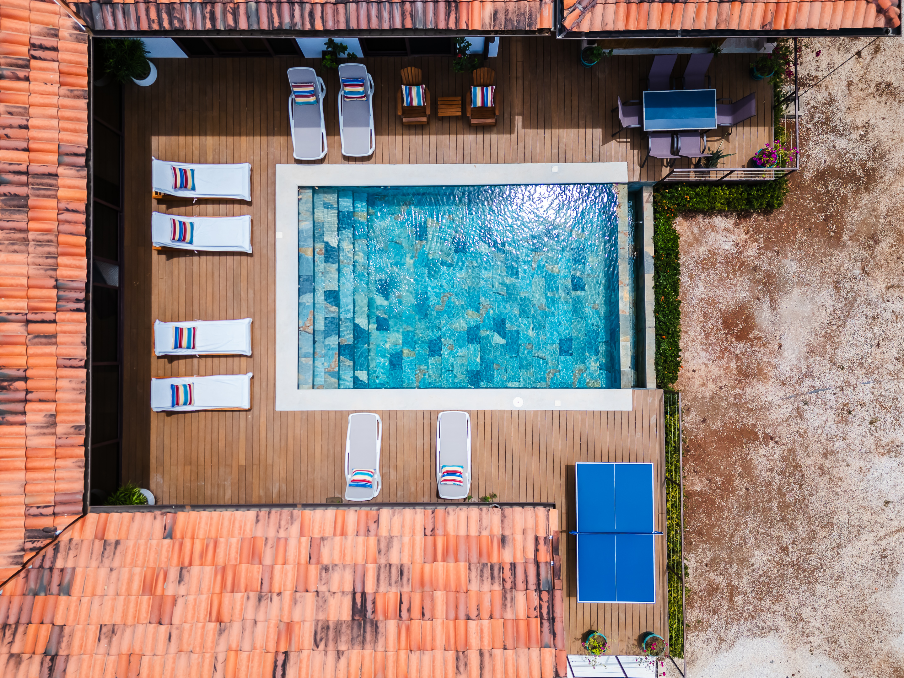 Panoramic air view of the pool and outdoor living space