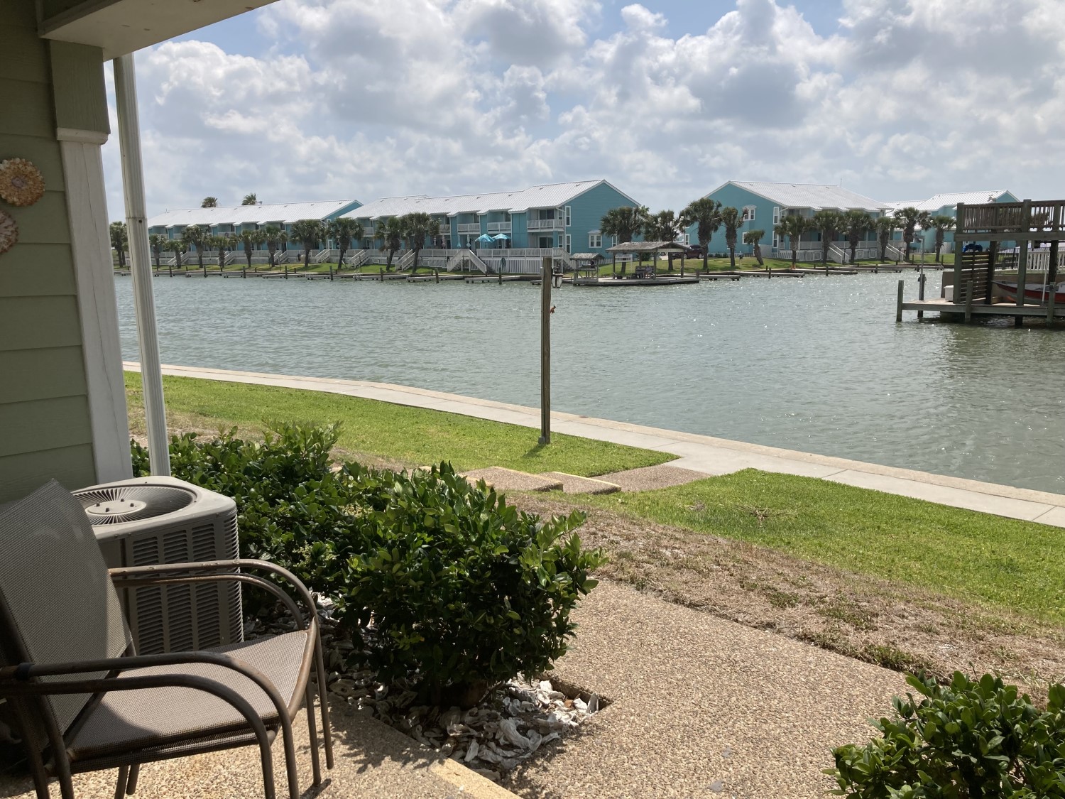 Canal located just feet away from back patio | Photo 3