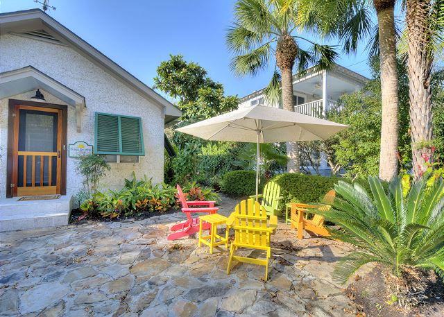 Sunny Showers Beach Cottage Front Sitting Area with Fan and Tesla Charger