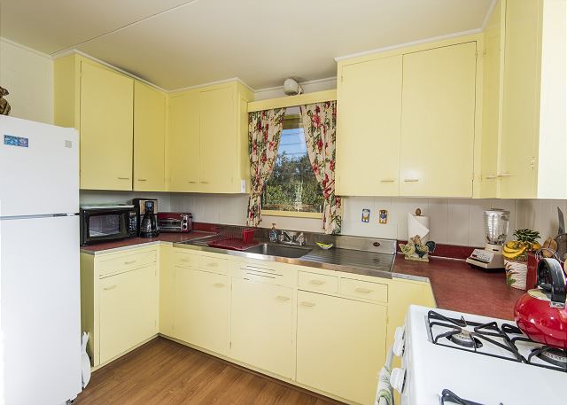 This fully stocked kitchen has a gas stove/oven, full size fridge, toaster oven, coffee maker, blender and more!