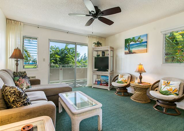 Living area with TV, Ceiling Fan and "peek a boo" ocean views.