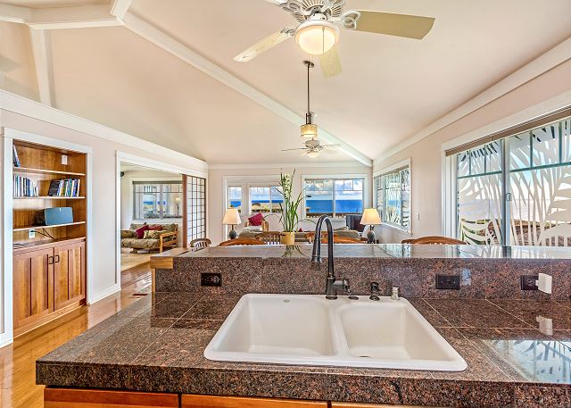 Kitchen with granite counter tops facing the ocean.
