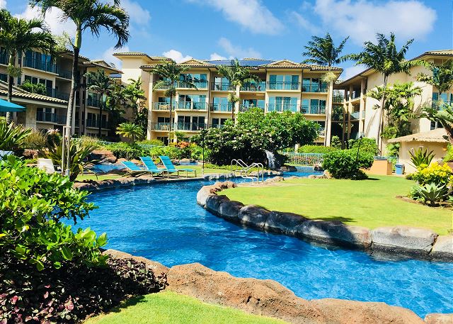 Beautiful 2 acre black lava rock pool with 2 slides and gardens