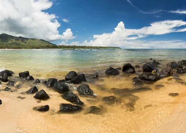Anahola Bay is a long stretch of sandy beach which offers many types of swimming and surfing spots. The far end is manned by lifeguards and offers a calm, protected swimming area with wonderful mountain and ocean views.