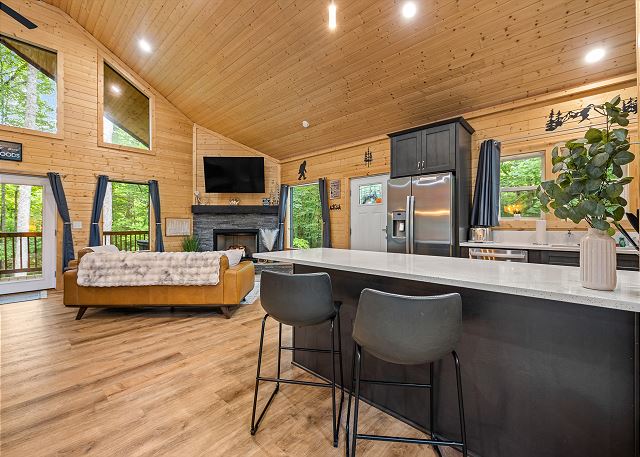 Television and Fireplace from Kitchen Counter Space with Stools
