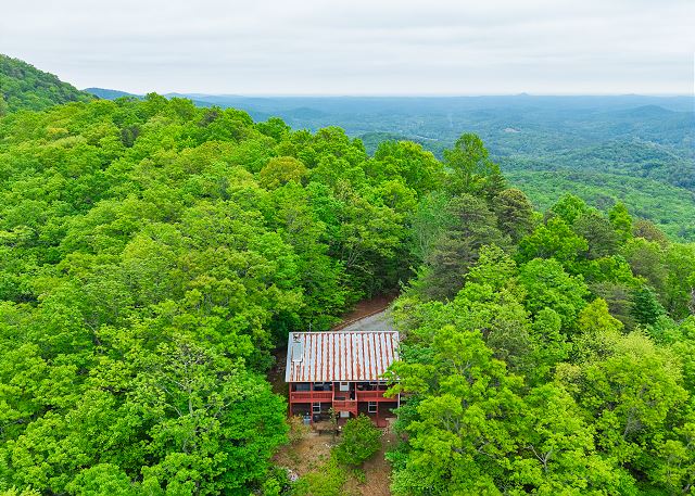 A secluded mountain retreat surrounded by lush forest
