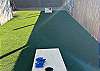 Backyard area with corn hole game