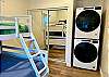 Bunk bedroom with washer and dryer