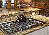 Make tea in the kettle using the gas cooktop