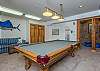 Lower level game room w/pool table and seating nook