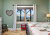 Lower level bedroom w/queen bed & views