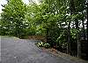 Parking area w/steps & walking path leading to the home.