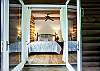 Main floor bedroom with king bed; opens to the deck