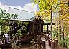 Beautiful log cabin with wrap around porch.