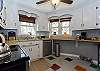 Kitchen amenities include coffee maker and dishwasher.