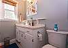 Full bathroom near kitchen and next to main floor queen bedroom