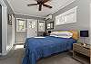 Upper level master suite w/ door out to private deck.