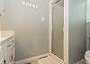 Main level twin bedroom bathroom w/ walk-in shower only.