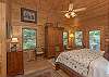 Master bedroom with king bed, full bath, and doors to back deck.