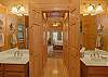 Master bathroom with shower, tub, and double sinks.