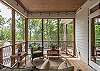 Screened in porch is the perfect escape for rainy afternoons.