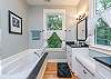 Master bathroom with soaking tub and walk-in shower.