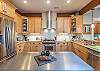 Kitchen island offers additional meal prep space.