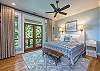 Master bedroom with king. French doors out to porch.