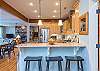 Kitchen bar provides additional seating for 3.