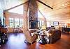 Living room with large 50" flat screen TV and wood fire place