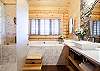 Master bathroom with soaking tub and walk-in shower.