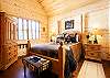 Main level guest suite with queen bed.