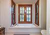 Master bathroom with soaking tub and walk-in shower.