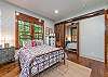 Downstairs bedroom with queen and alcove with sliding barn doors