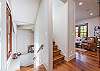 Staircase leading up to Master suite and downstairs to queen bed