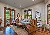 Living area with french doors leading out to wrap around deck.