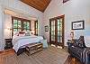 Master suite upstairs with king bed and sitting area.